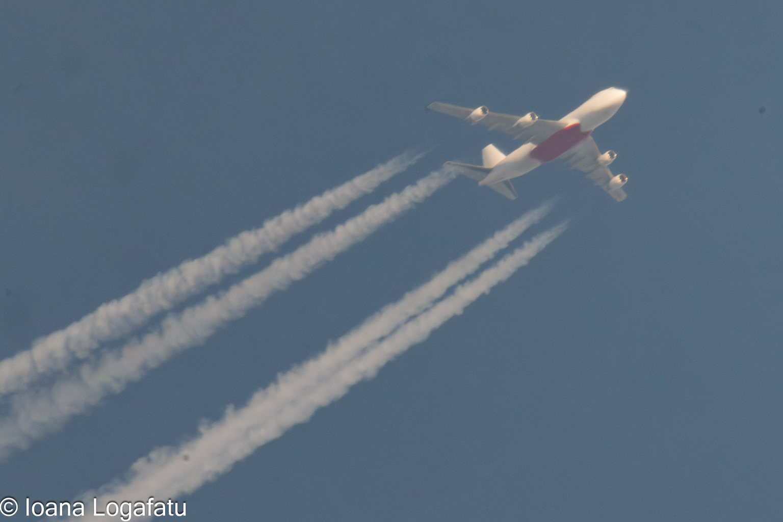 Majestic aircraft soaring through a clear blue sky